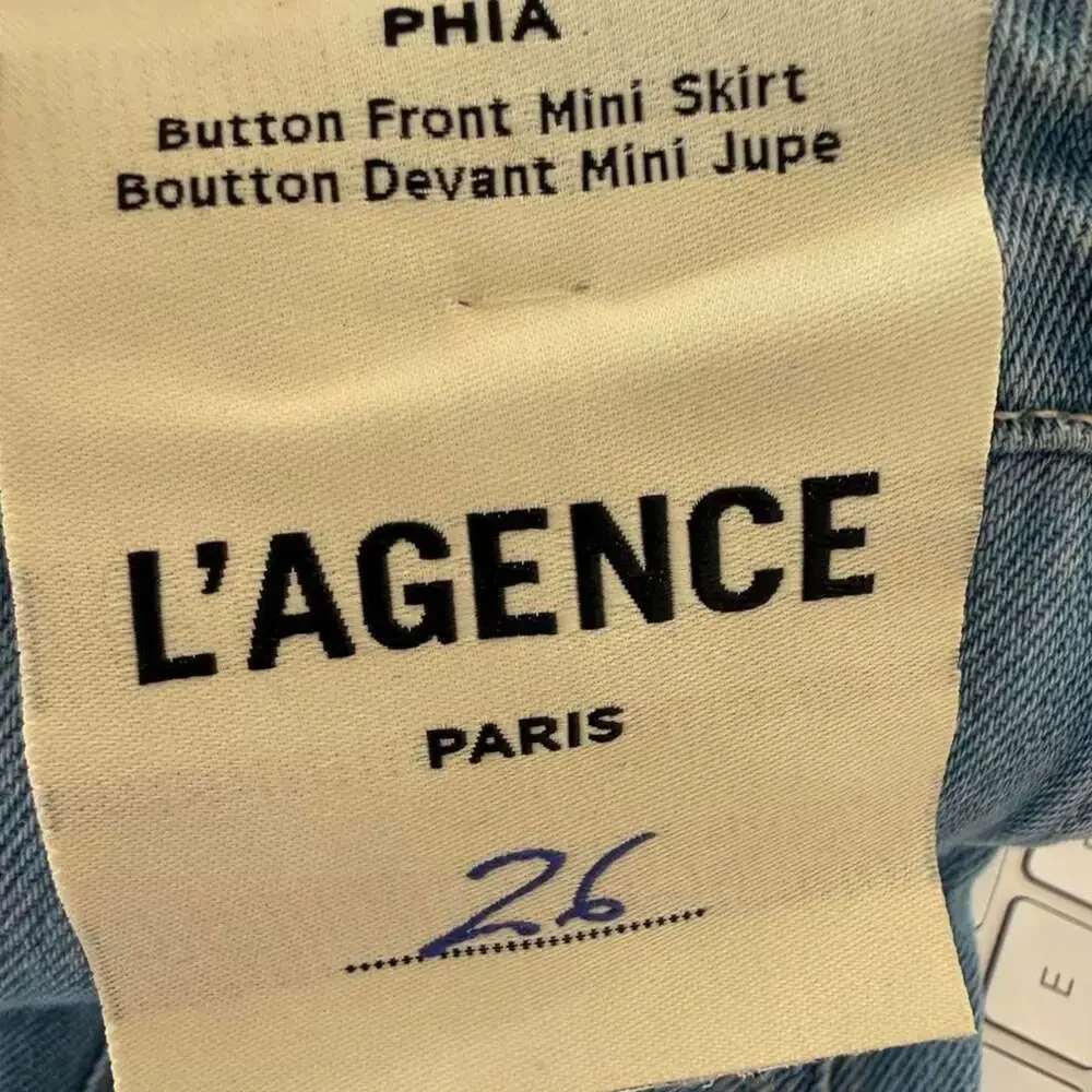 L'Agence Phia Seamed Button Front Mini Skirt | Light Wash Denim Concho Buttons |